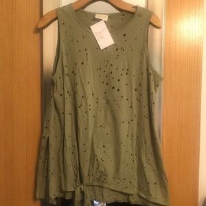 Green top with distressed holes and tie at bottom size Large. 143 Story brand